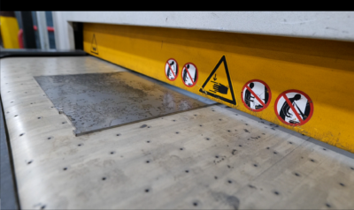 recently laser cut part going into the Arku Deburr Machine